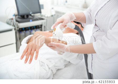 Woman arm doing treatment for client 42155933
