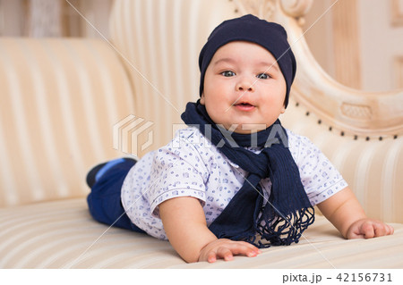 Cute newborn baby boy in sunny room 42156731