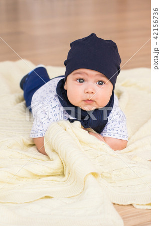 Cute newborn baby boy in sunny room Cute newborn baby boy in sunny room 42156736