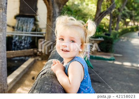 Portrait of little toddler Girl Smiling at Camera Portrait of little toddler Girl Smiling at Camera 42158023