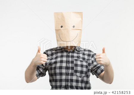 men in happy paper bag mask with thumbs up on white background men in happy paper bag mask with thumbs up on white background 42158253