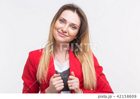 fashionable young woman posing in red suit 42158609