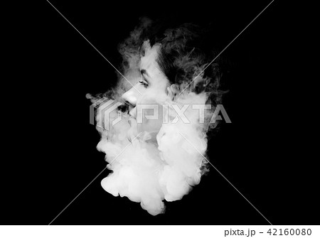 creative of art woman portrait and smoke in face. black in white portrait and smoke on black creative of art woman portrait and smoke in face. black in white portrait and smoke on black 42160080