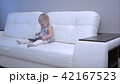 Baby playing with tablet at home 42167523