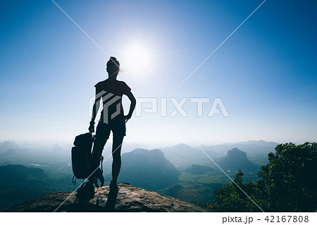 Successful woman hiker in the sunrise mountain top 42167808