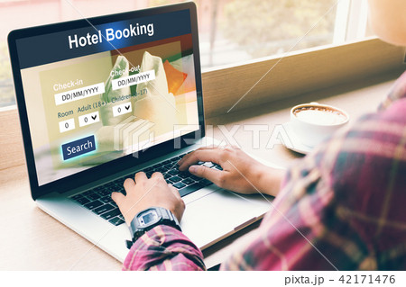 Man using laptop to make hotel booking reservation Man using laptop to make hotel booking reservation 42171476