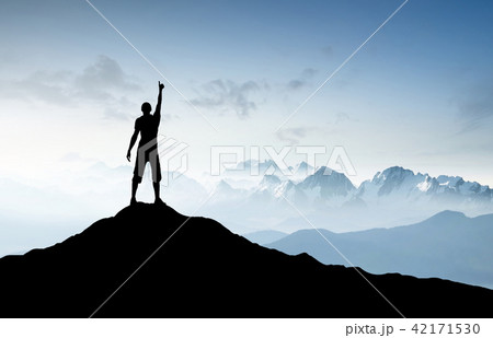 Winner silhouette on the mountain top. Winner silhouette on the mountain top. 42171530