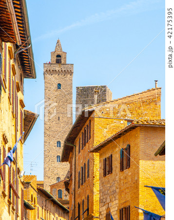 Torre Grossa, Big Tower. Bottom view from medieval streets of San Gimignano, Italy. Torre Grossa, Big Tower. Bottom view from medieval streets of San Gimignano, Italy. 42175395