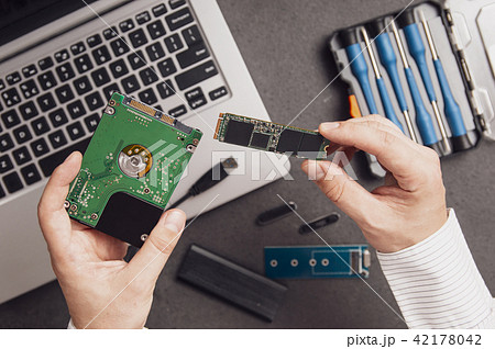 Man prepares to replace an old HDD drive 42178042