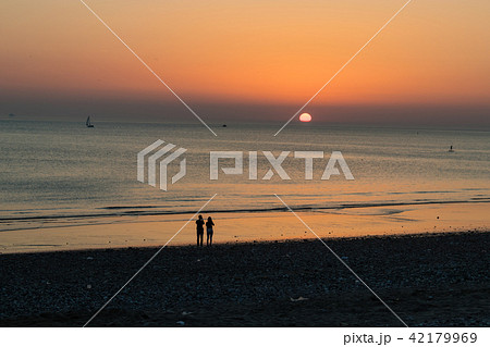 Sunset at the beach with romantic couple Sunset at the beach with romantic couple 42179969