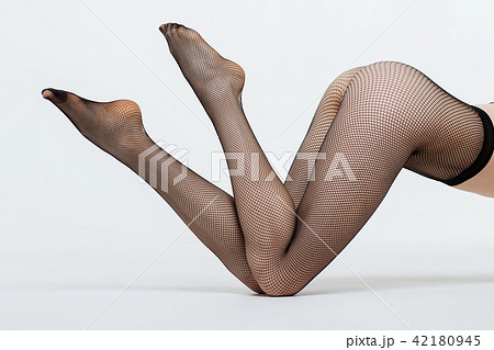 Young woman in pantyhose on bed 42180945