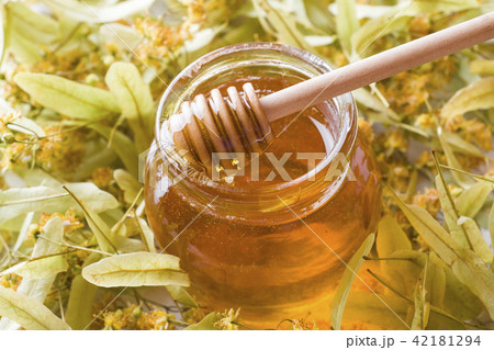 Glass jar of honey, Linden flowers Glass jar of honey, Linden flowers 42181294