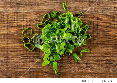 Fresh Raw green spring onion on brown wood Fresh Raw green spring onion on brown wood 42181731