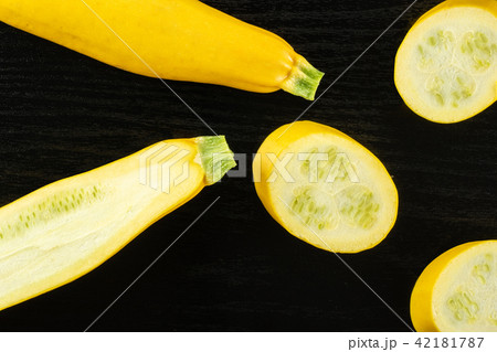 Fresh Raw yellow zucchini on black wood Fresh Raw yellow zucchini on black wood 42181787
