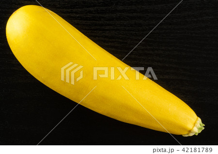 Fresh Raw yellow zucchini on black wood Fresh Raw yellow zucchini on black wood 42181789