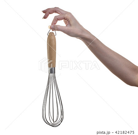 Woman hand holding whisk egg for beater Woman hand holding whisk egg for beater 42182475