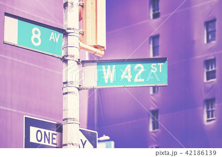 West 42 Street and 8th Avenue street name signs. 42186139