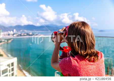 A young woman looks at the city 42186456