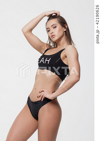 Woman in black underwear holding hair Woman in black underwear holding hair 42190626
