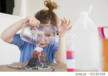 Girl making volcano 42192308