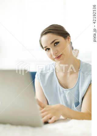 Woman using laptop Woman using laptop 42192536