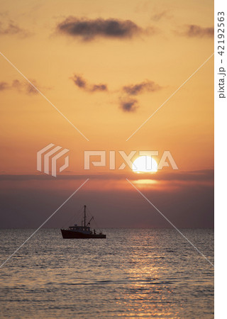 Fishing boat at sunset 42192563