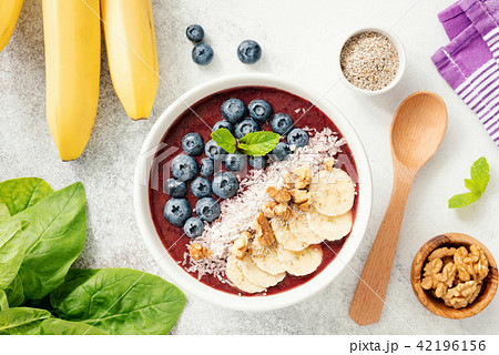 Acai smoothie bowl with blueberry, banana,walnut, coconut and chia seed Acai smoothie bowl with blueberry, banana,walnut, coconut and chia seed 42196156