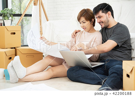 Young couple planning their new house. Young couple planning their new house. 42200188