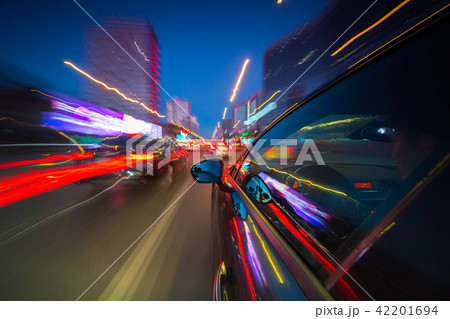 View from Side of Car moving in a night city View from Side of Car moving in a night city 42201694