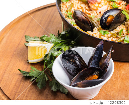 paella with seafood and vegetables paella with seafood and vegetables 42208502