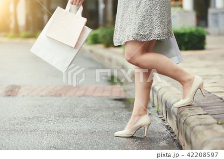 Woman crossing road 42208597