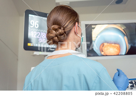 Doctor for internal medicine checking screen during examination 42208805