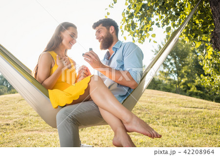 Young man making marriage proposal to his beautiful girlfriend 42208964