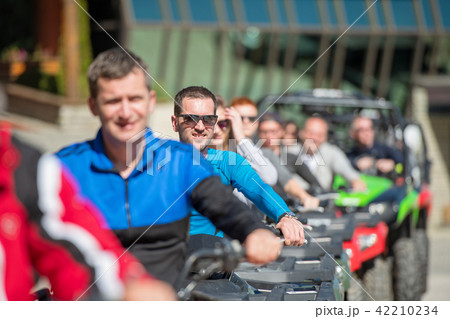 man riding atv vehicle on off road track ,people outdoor sport activitiies theme 42210234