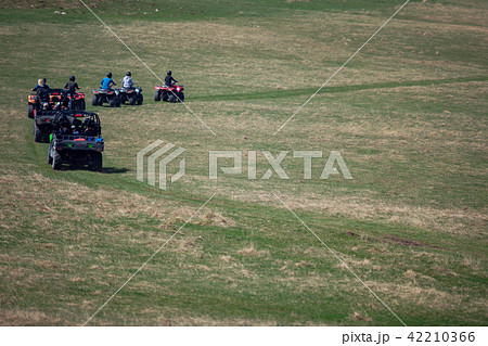 man riding atv vehicle on off road track ,people outdoor sport activitiies theme 42210366