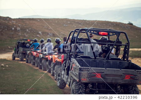 man riding atv vehicle on off road track ,people outdoor sport activitiies theme 42210396
