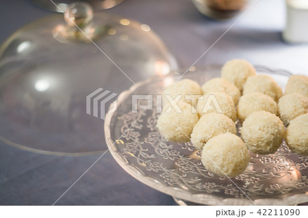 Cakes with coconut truffles in the evening light Cakes with coconut truffles in the evening light 42211090