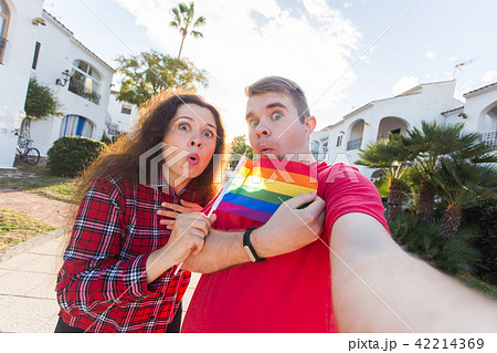 Young man and woman surprised when the first time came gay parade 42214369