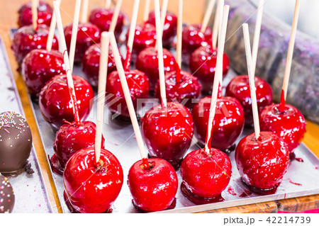 Red apples on a stick in caramel yum yum 42214739