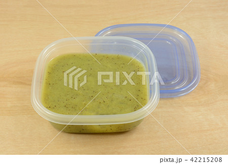 Kiwi fruit puree ingredient in storage container 42215208