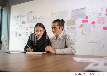 Beautiful secretary helping boss in office. 42219697