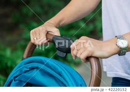 Overhead shot of young mother strolling a carriage 42220152