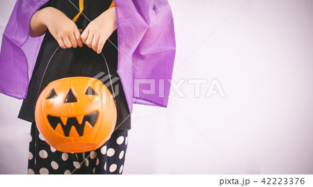 Beautiful girl witch with pumpkin 42223376