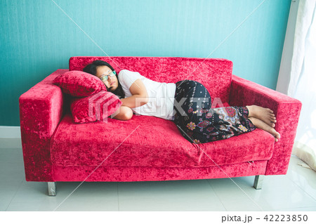 young woman sleeping on sofa at home young woman sleeping on sofa at home 42223850