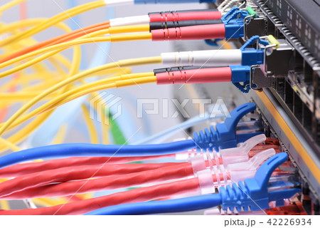 Fiber optic and network cables in data center Fiber optic and network cables in data center 42226934