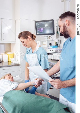 Doctor greeting patient before starting treatment Doctor greeting patient before starting treatment 42229076