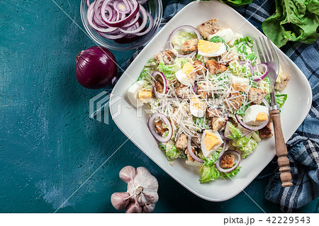 Caesar salad with chicken, eggs and croutons 42229543