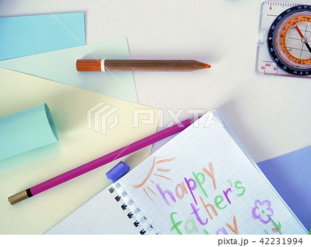 Compass, tools, notepad with a congratulation to t 42231994