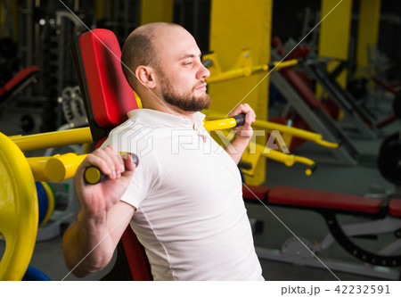 Fitness, athlete, bodybuilding and people concept - Muscular bodybuilder in gym 42232591