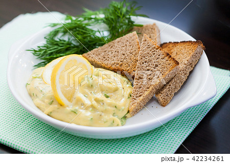 mayonnaise sauce with slices of lemon and dill 42234261